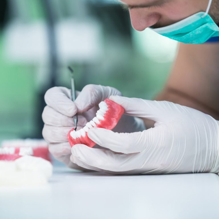dentist-working-on-dentures